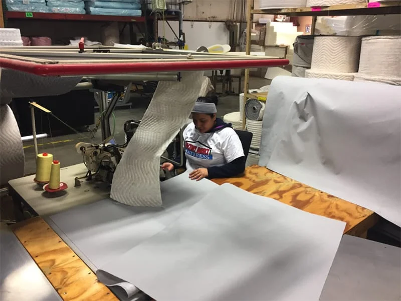 Image of a lady cutting sheets